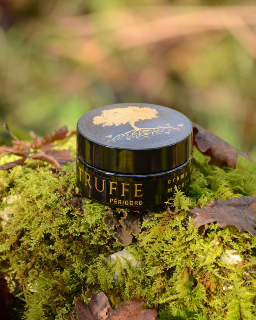 Truffle Skincare product sitting on moss.