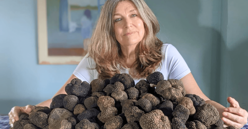Julie Stopforth holding a table full of truffles in her arms