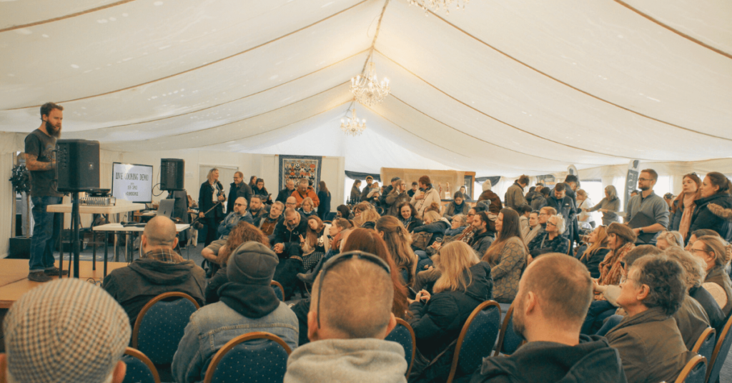 Speaker on stage in front of crowd at the UK truffle Festival 2023